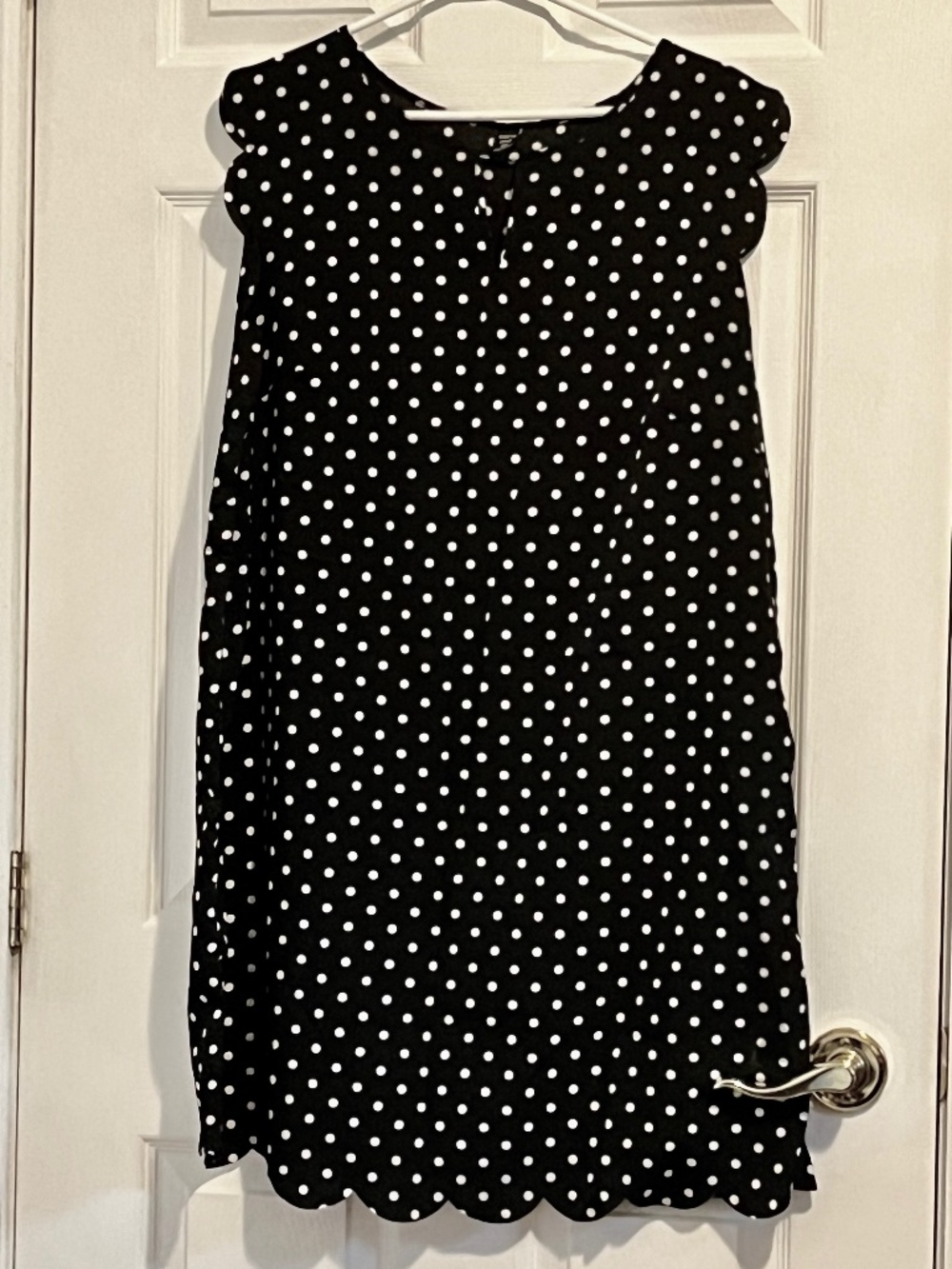 Black and white polka dot blouse with scallop hems